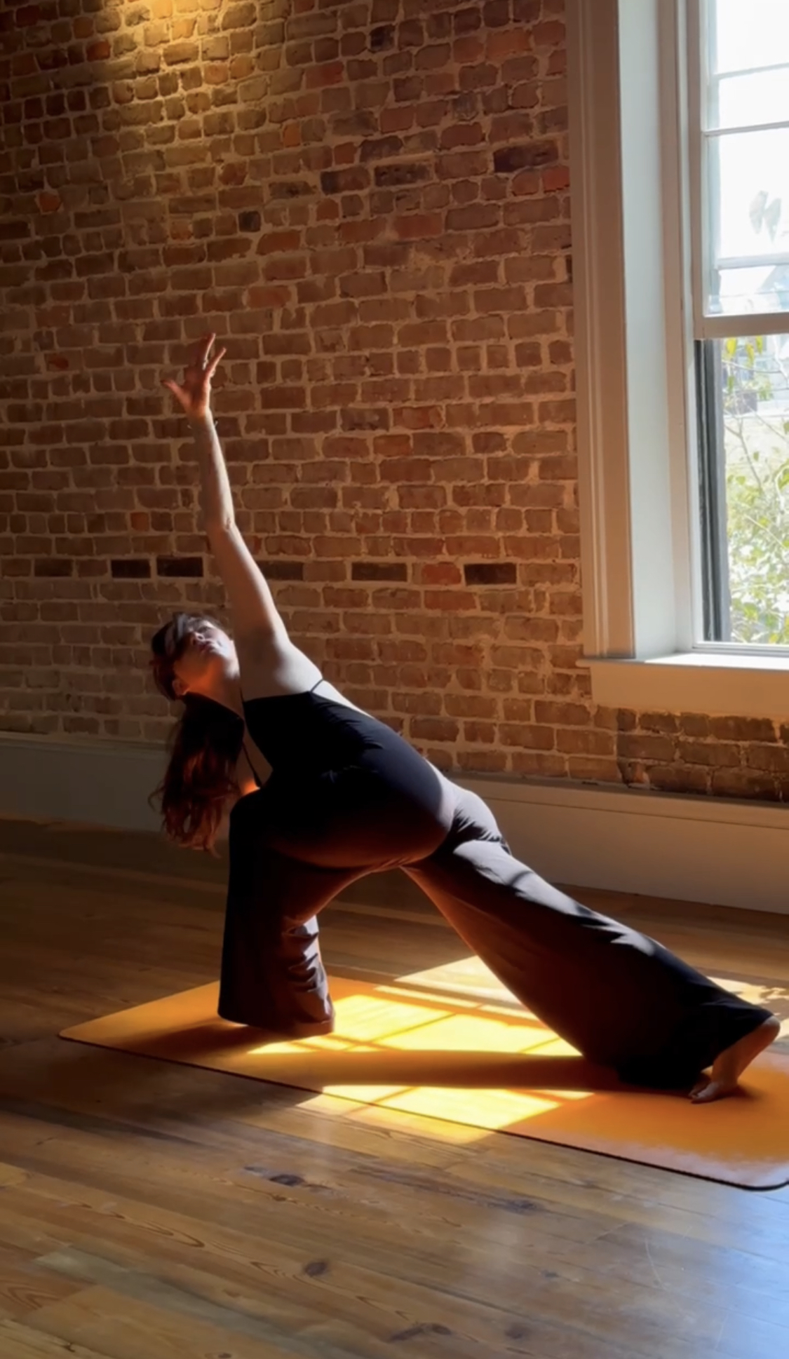 A teacher leading a slow vinyasa class